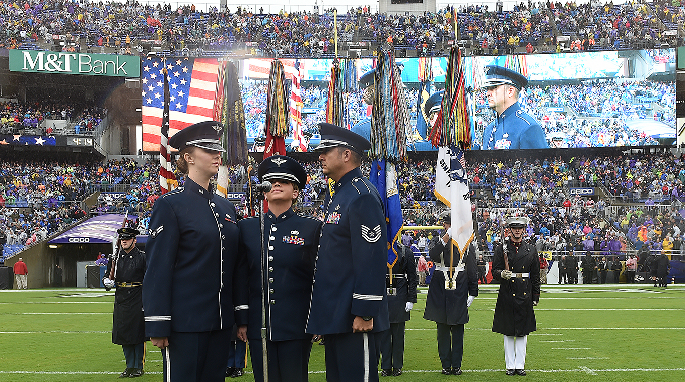 Technical Sergeant Justin Allen, Staff Sergeant Melissa Lackore, and Airman First Class Rachael Colman of the USAF Heritage of America Band sing